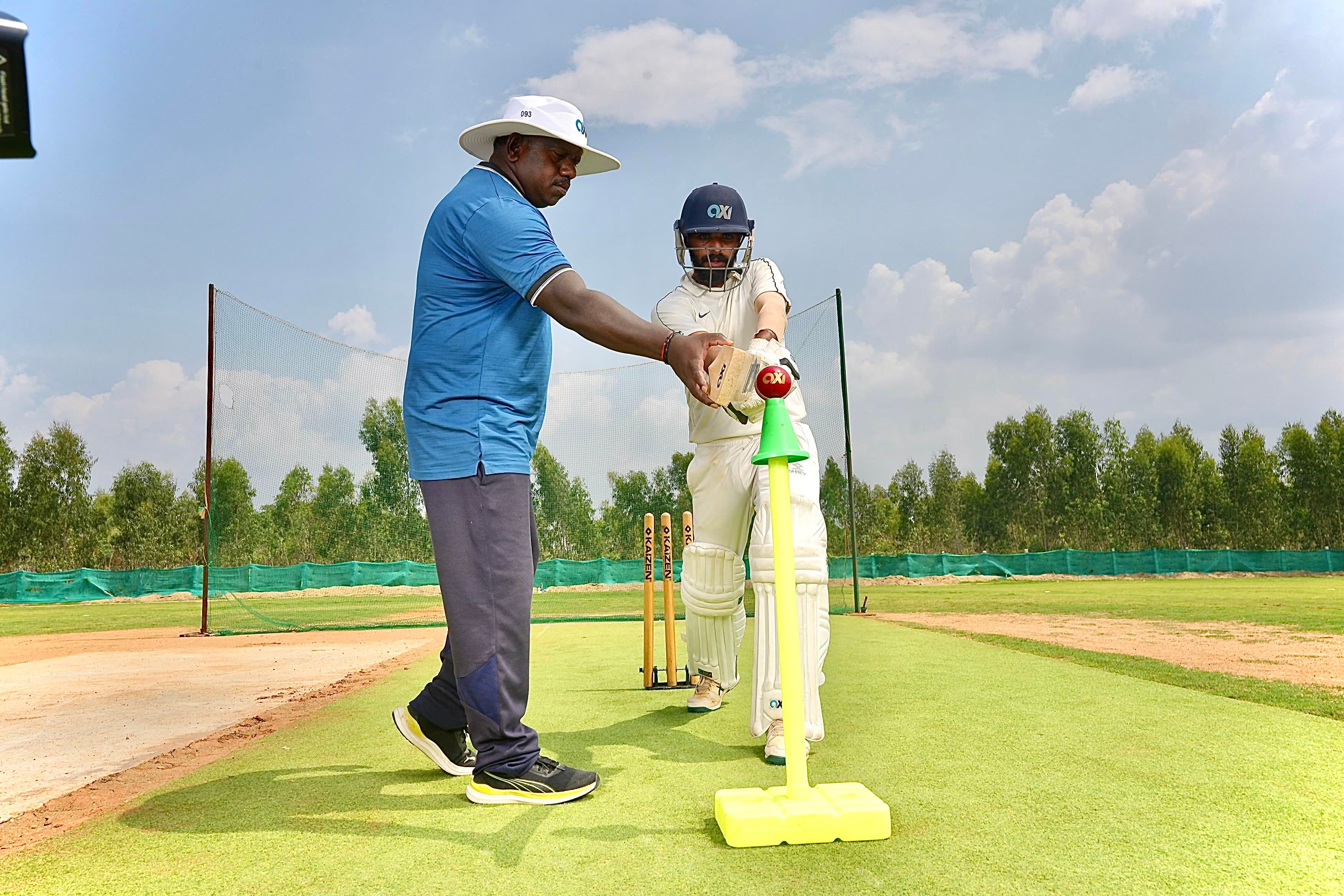 Cricket player batting at the academy